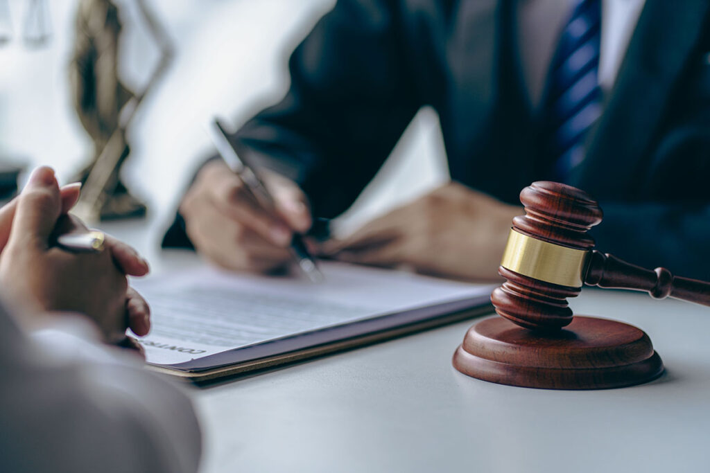 Attorney reviewing fee litigation papers | Corporate Synergies