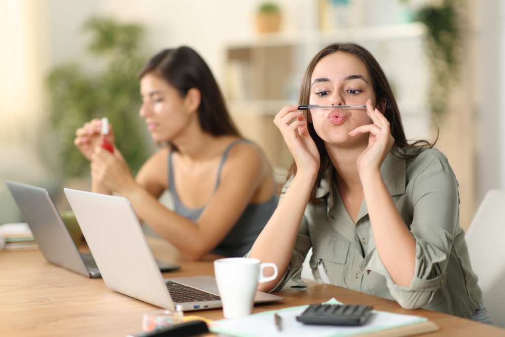 Two bored disengaged employees | Corporate Synergies