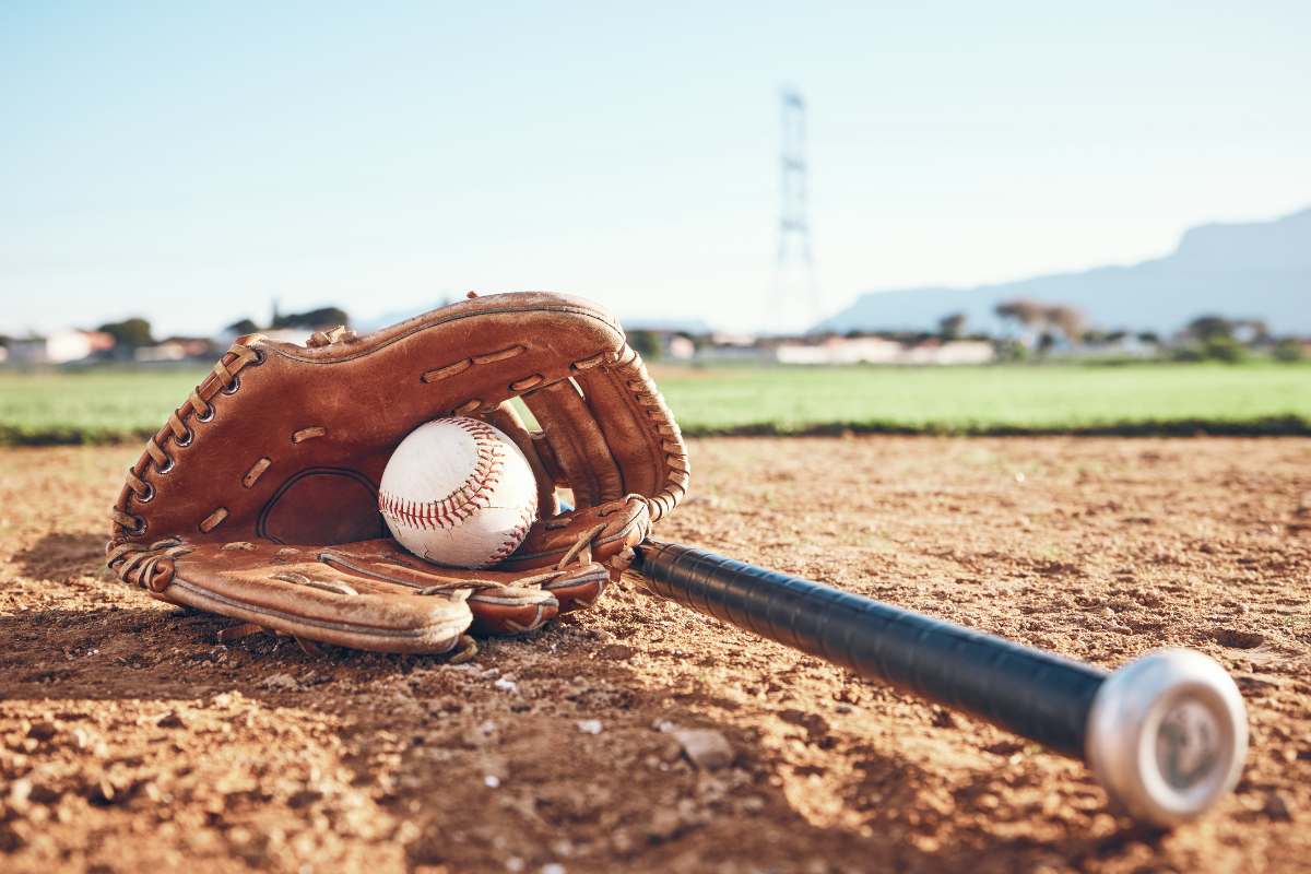 Bat, mitt and ball representing the moneyball approach in baseball and beyond | Corporate Synergies