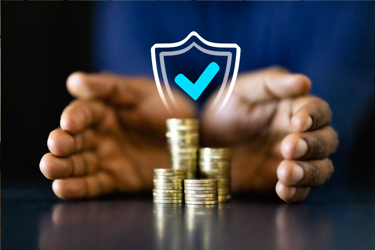 Hands cover coin stacks with a shield and checkmark to signal income protection| Corporate Synergies