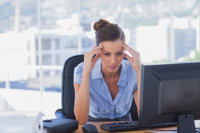 A disengaged female employee illustrates why making mental health benefits meaningful is important | Corporate Synergies