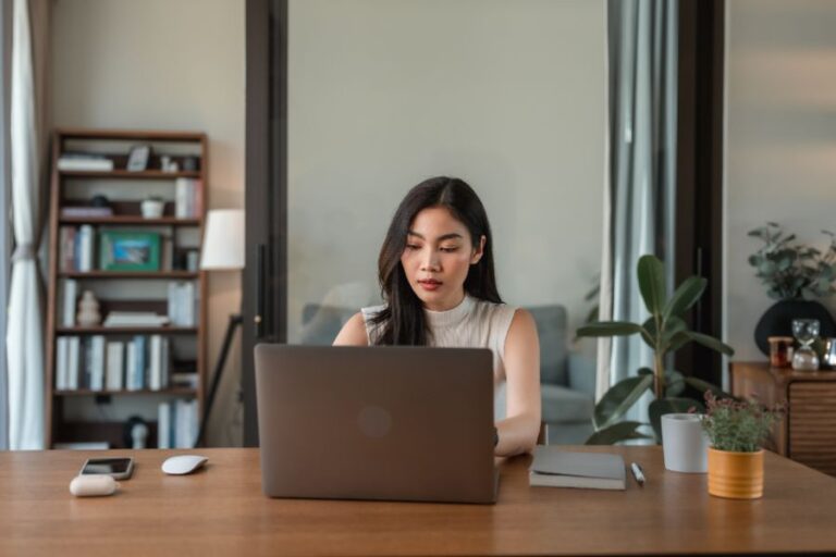 An employee reviews the back to basics health insurance information provided by her employer| Corporate Synergies