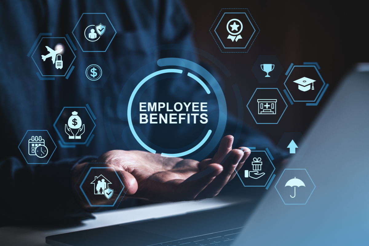 Icons float above a man’s hands to signify the hidden ROI in employee benefits| Corporate Synergies