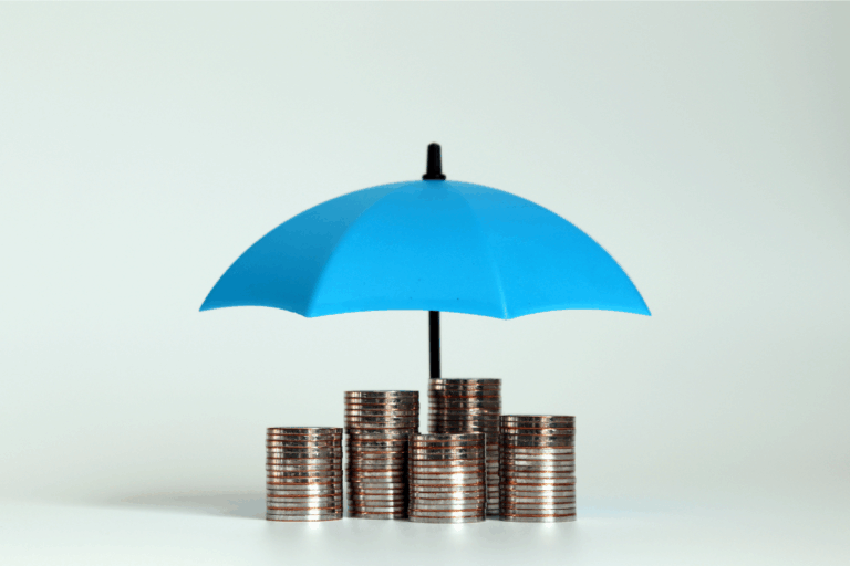 Coin stacks under an umbrella illustrate how pooling levels help manage risk for employers| Corporate Synergies