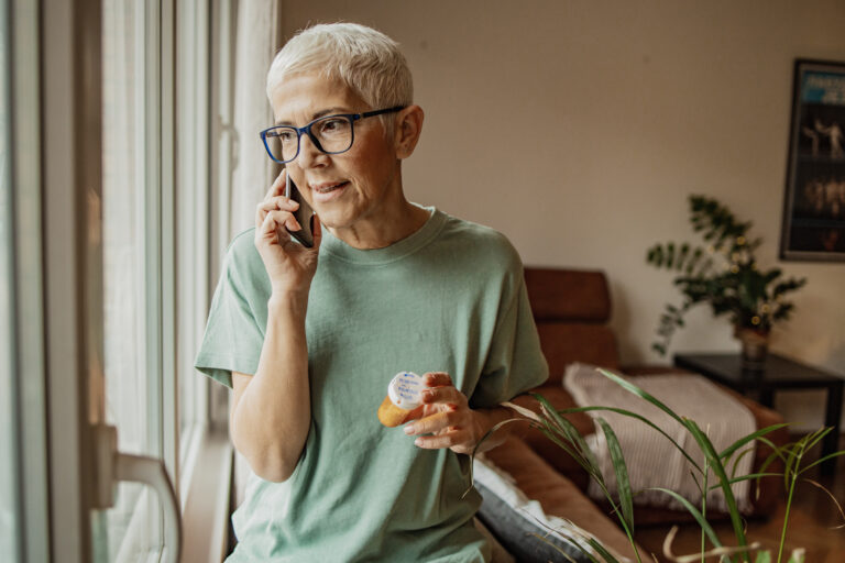 Older employee on call with health advocate about how to utilize her benefits |Corporate Synergies