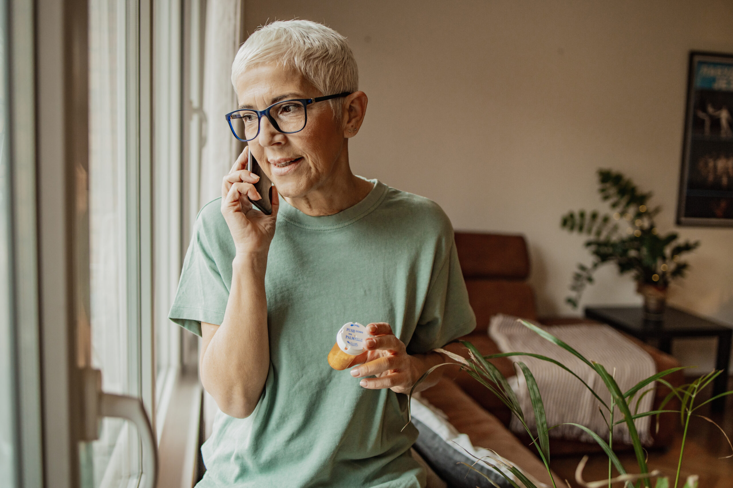 Older employee on call with health advocate about how to utilize her benefits |Corporate Synergies