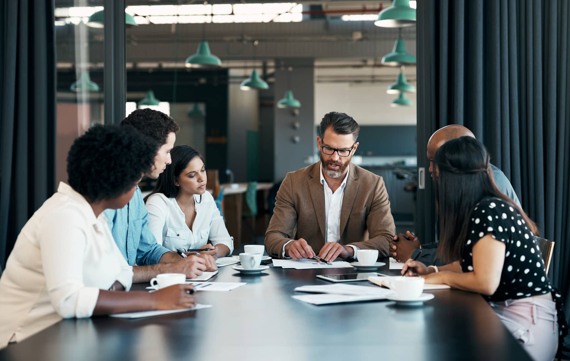 HR team reviews plan fiduciary responsibility during a meeting ahead of benefits renewal season. |Corporate Synergies