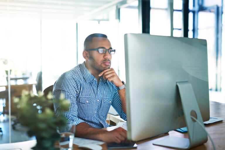An HR officer reviews their benefits technology strategy while testing the system ahead of open enrollment. | Corporate Synergies