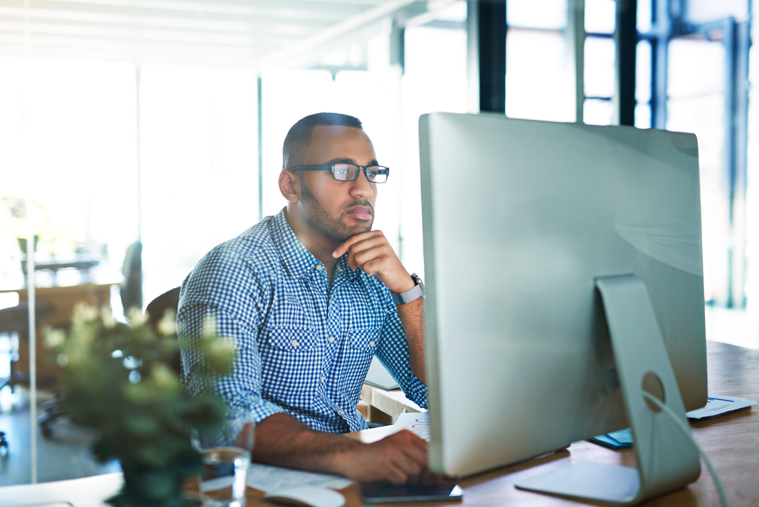 An HR officer reviews their benefits technology strategy while testing the system ahead of open enrollment. | Corporate Synergies